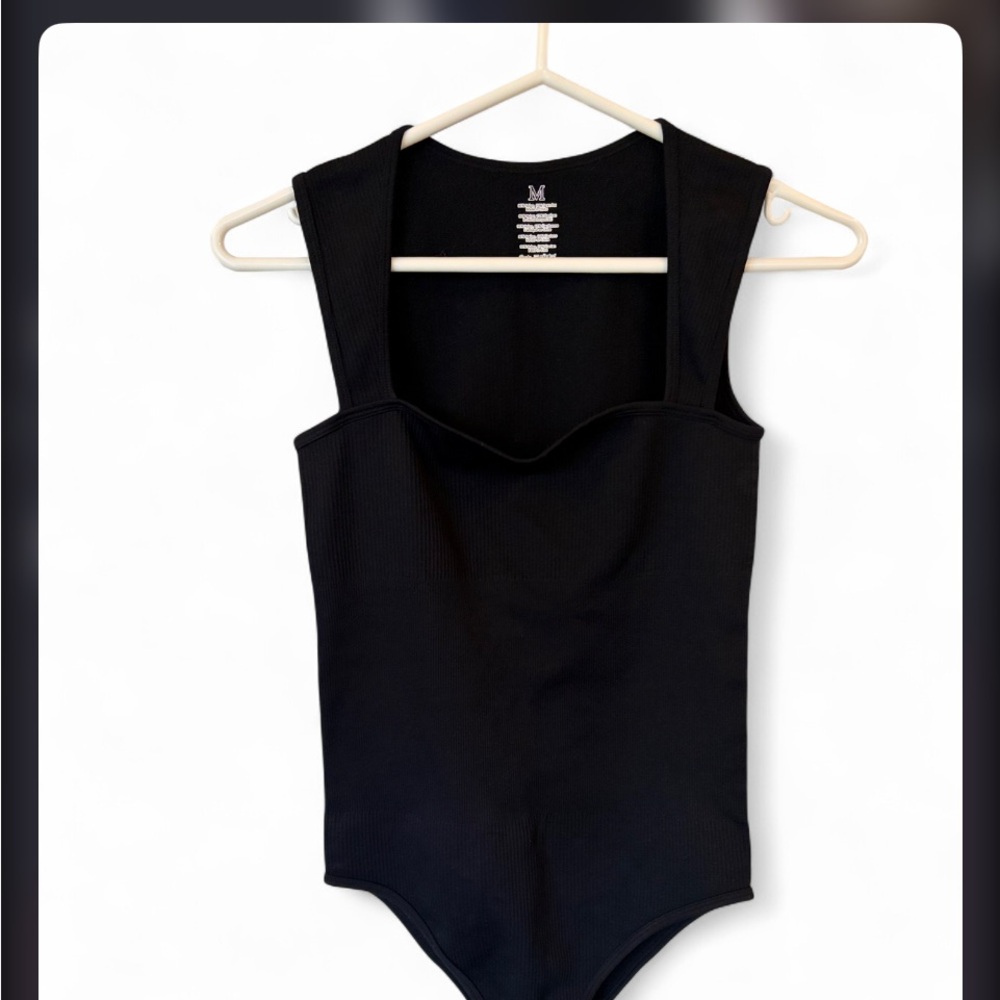 Classic Black Ribbed women’s One-Piece Bodysuit